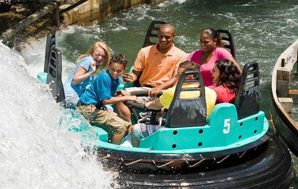 6 guests on Carowind's Rip Roarin' Rapids Six Flags Cedar Fair merger