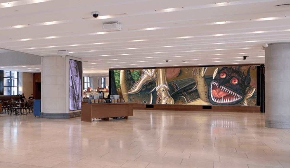 A modern National Gallery lobby with a long mural depicting a snarling, red-eyed creature.