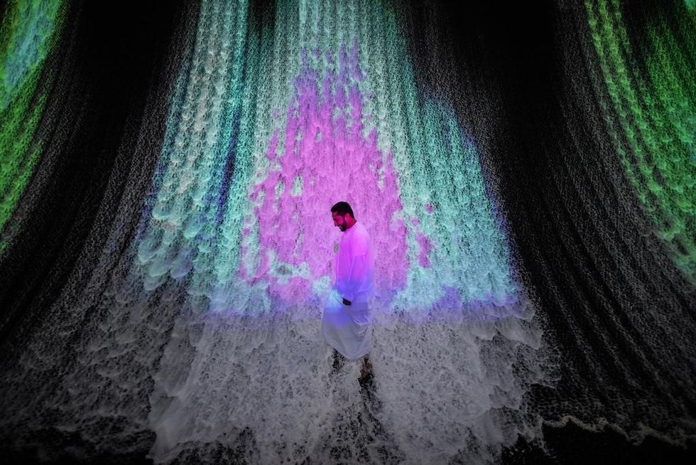 A visitor at Surreal, the Water Feature