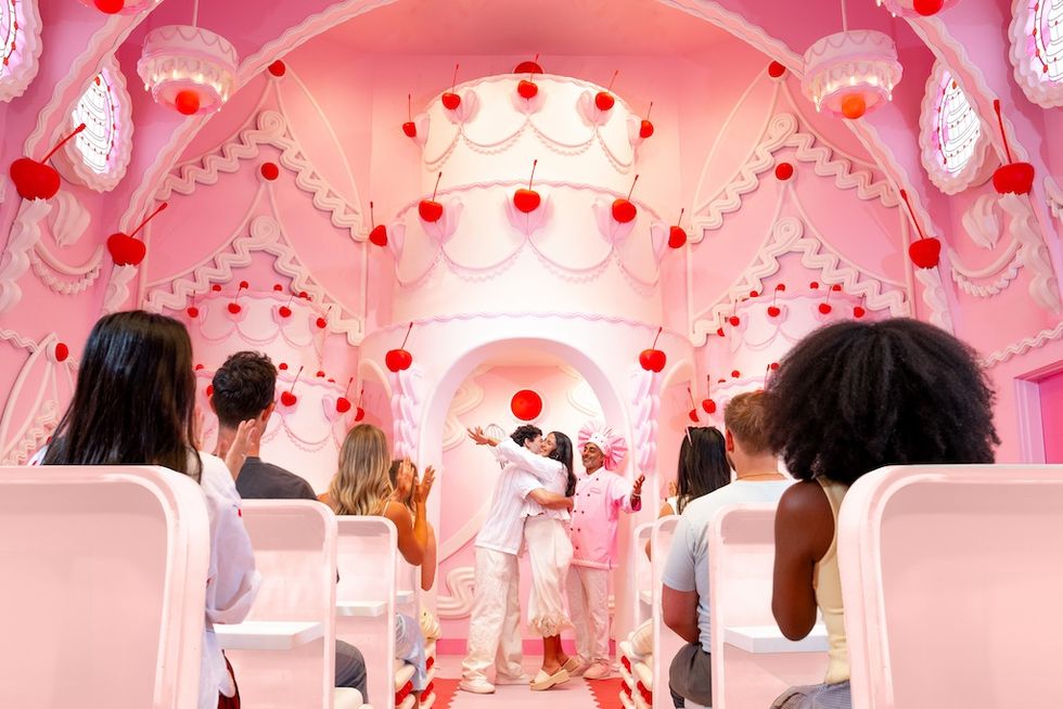 A whimsical, pink cake-themed chapel with cherry decorations at Museum of Ice Cream in Vegas