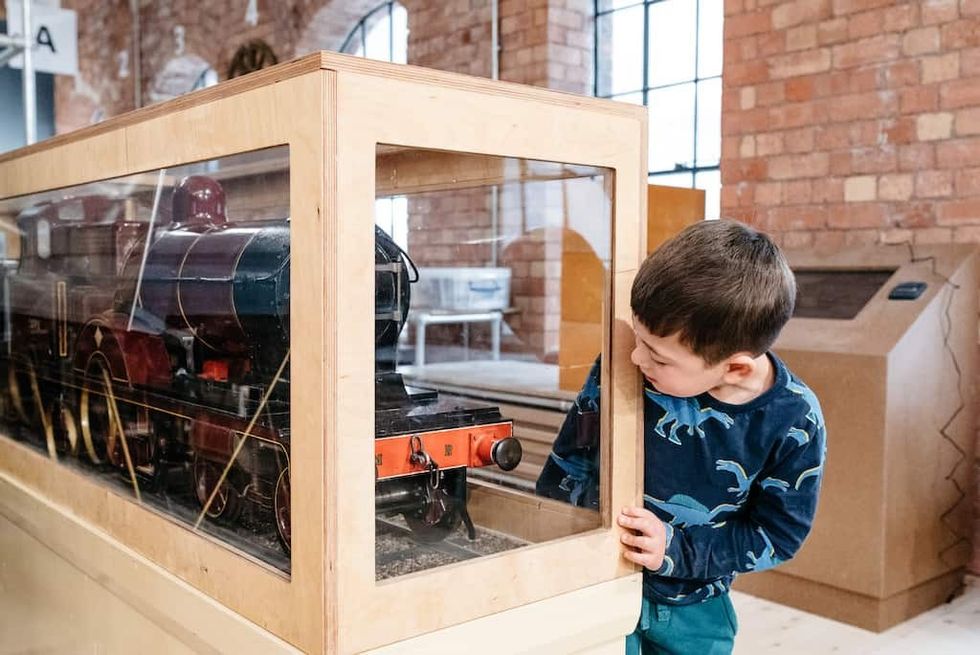 A young visitor explores the Museum of Making