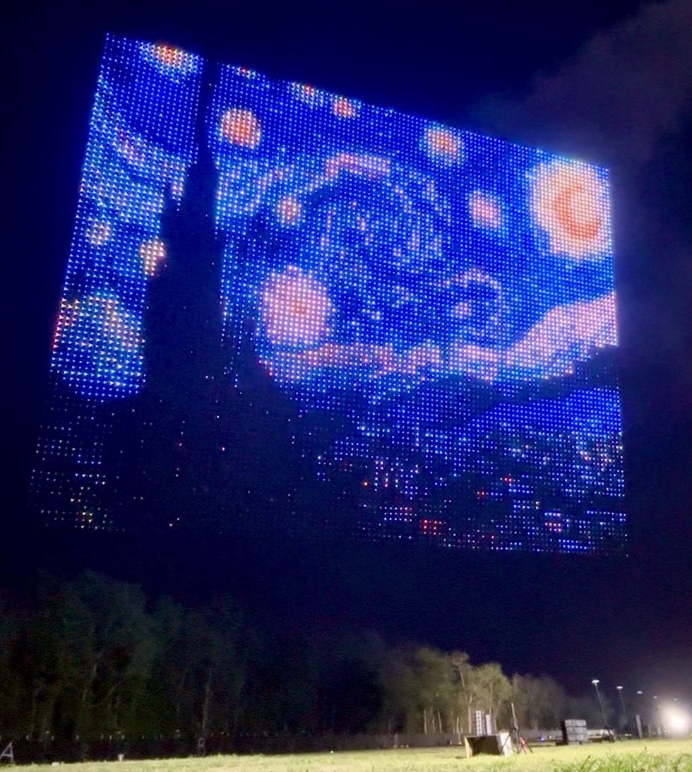 Aerial drone display of "Starry Night" over a field at night by Aerial Illuminations
