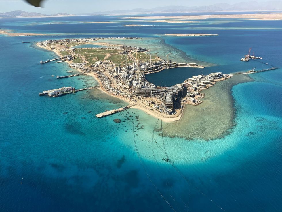 Aerial view of a complex on a small island called Sindalah surrounded by clear blue water