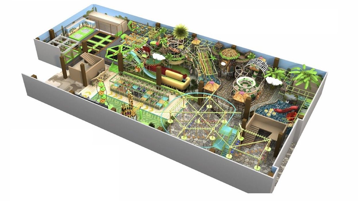Aerial view of a jungle-themed indoor playground with slides and trampolines.