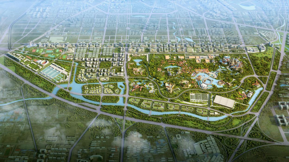 Aerial view of a large urban park with lush greenery and winding waterways.