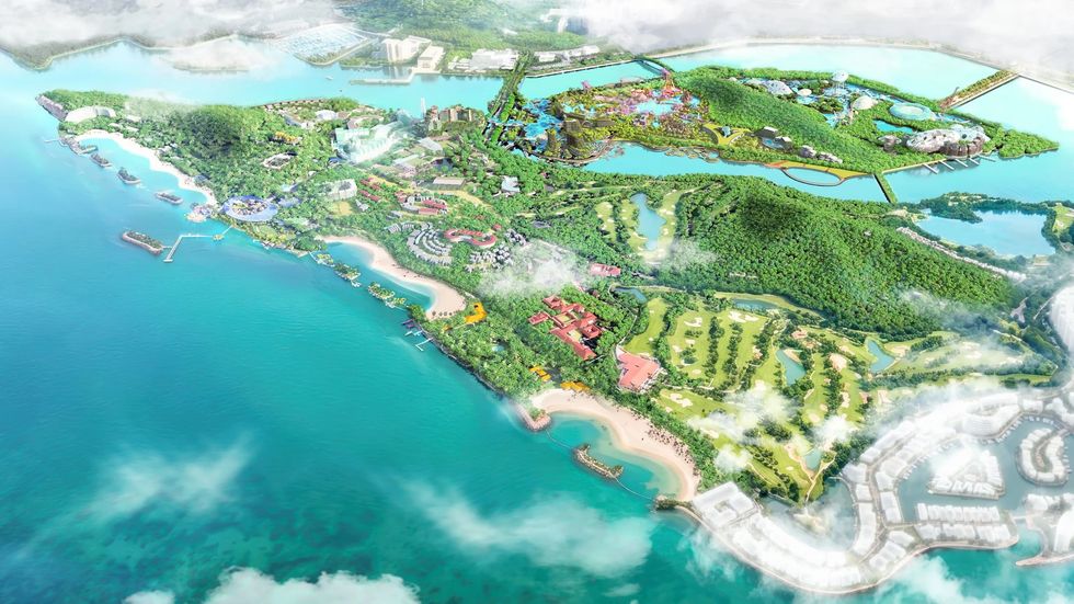 Aerial view of a lush island resort called Greater Sentosa with beaches, greenery, and water attractions.