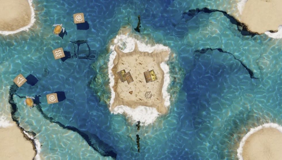 Aerial view of a sandy island with surrounding blue water and floating platforms.