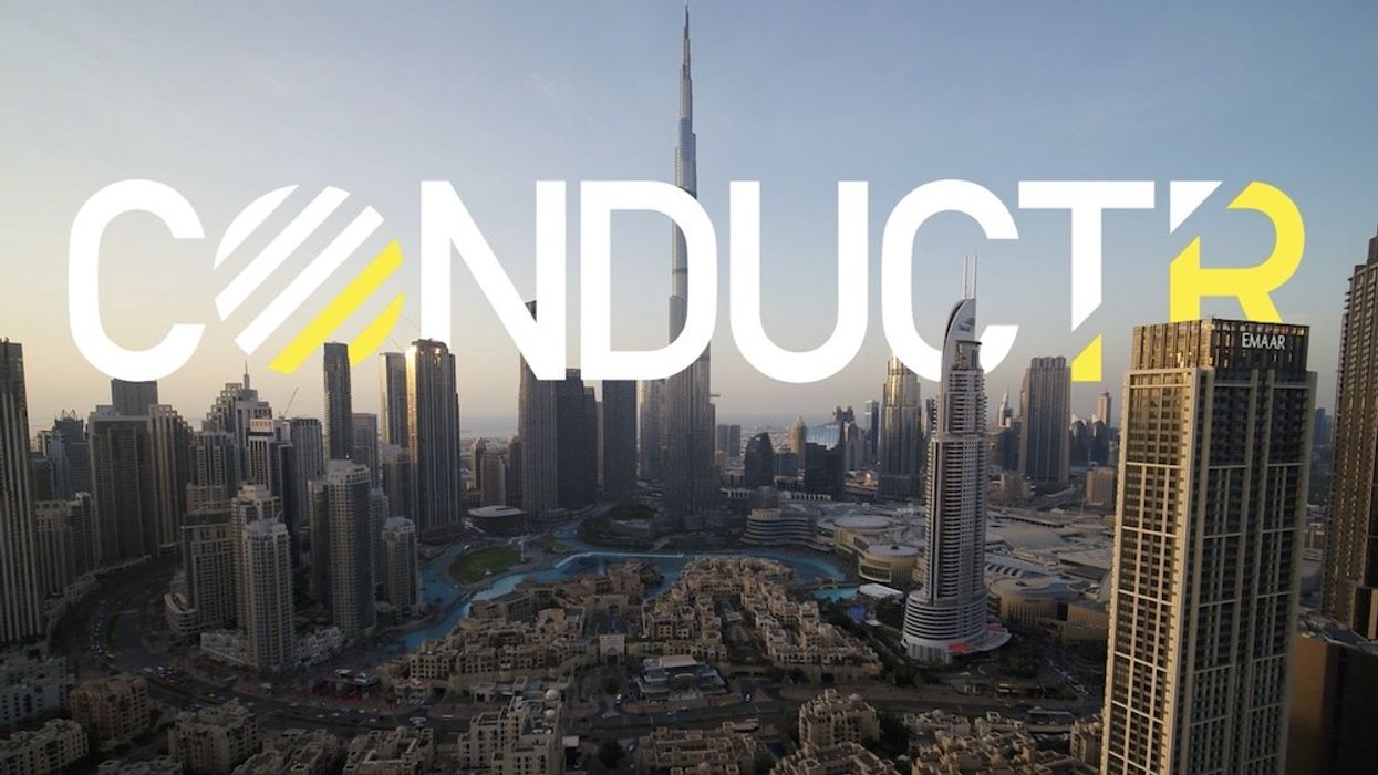 Aerial view of Dubai skyscrapers with "CONDUCTR" text overlay.