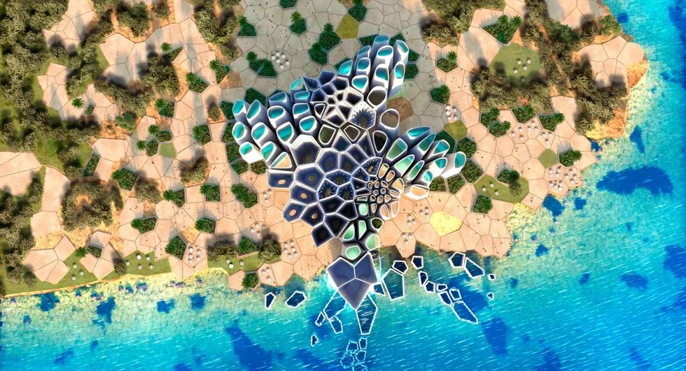 Aerial view of geometric coastline design blending into the turquoise sea.