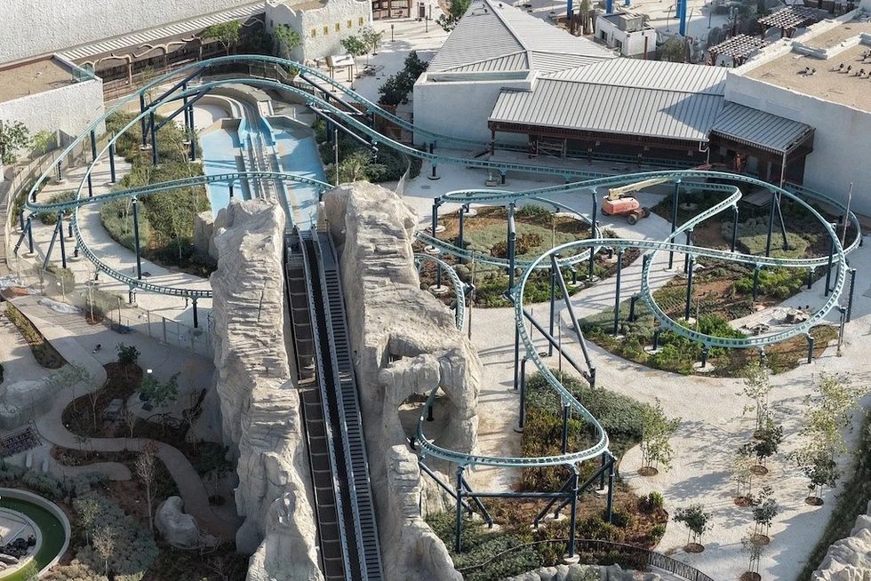 Aerial view of Sea Stallion roller coaster with track loops and rocky terrain.