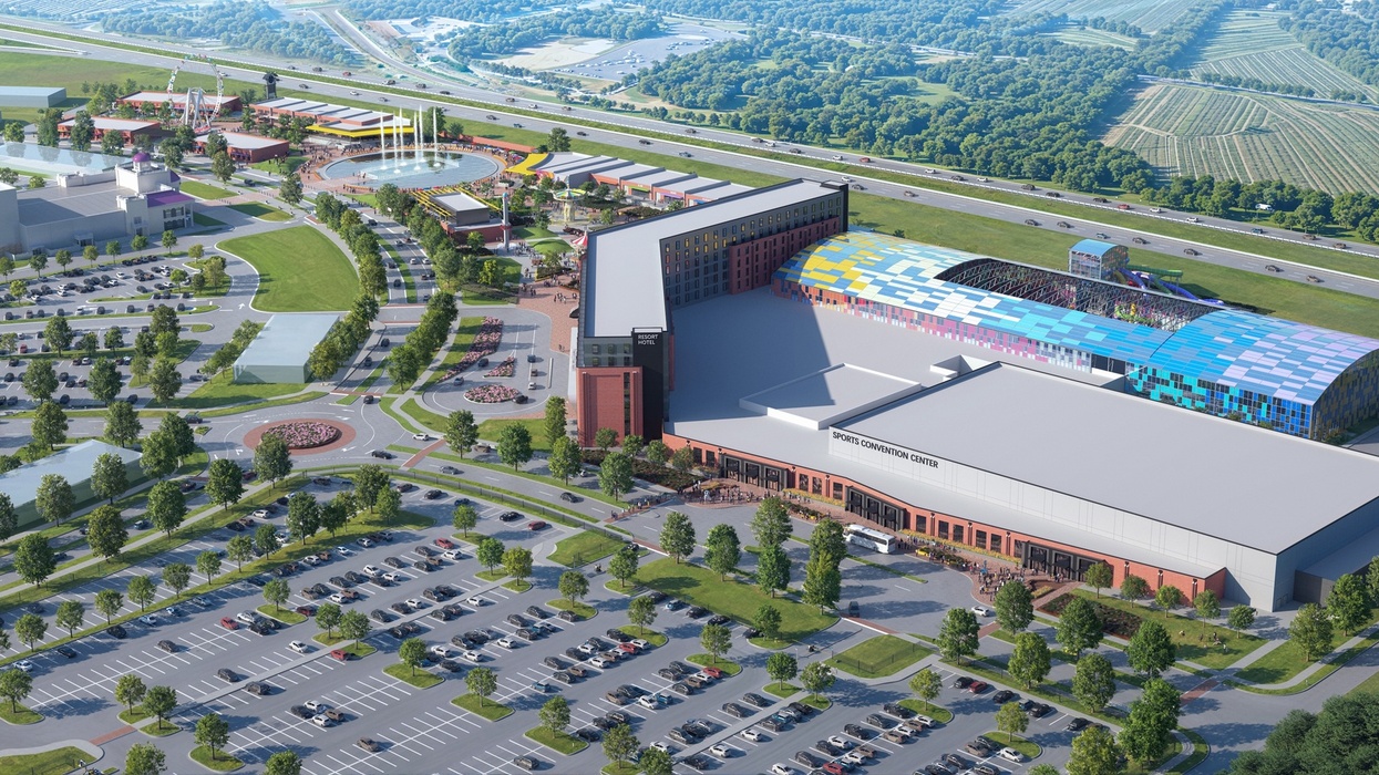 Aerial view of Weldon Mills Resort in North Carolina with colorful roof and surrounding parking lots.