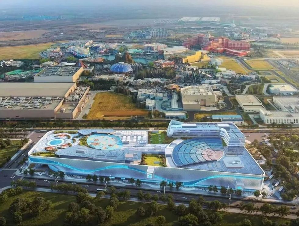 Aerial view rendering of the Beijing Haichang Ocean Park complex, with colourful buildings and landscaped areas.
