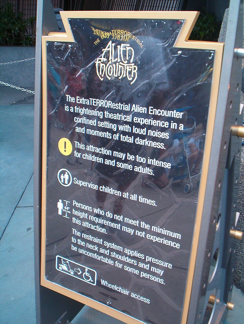 Alien Encounter warning sign with ride details and safety precautions.