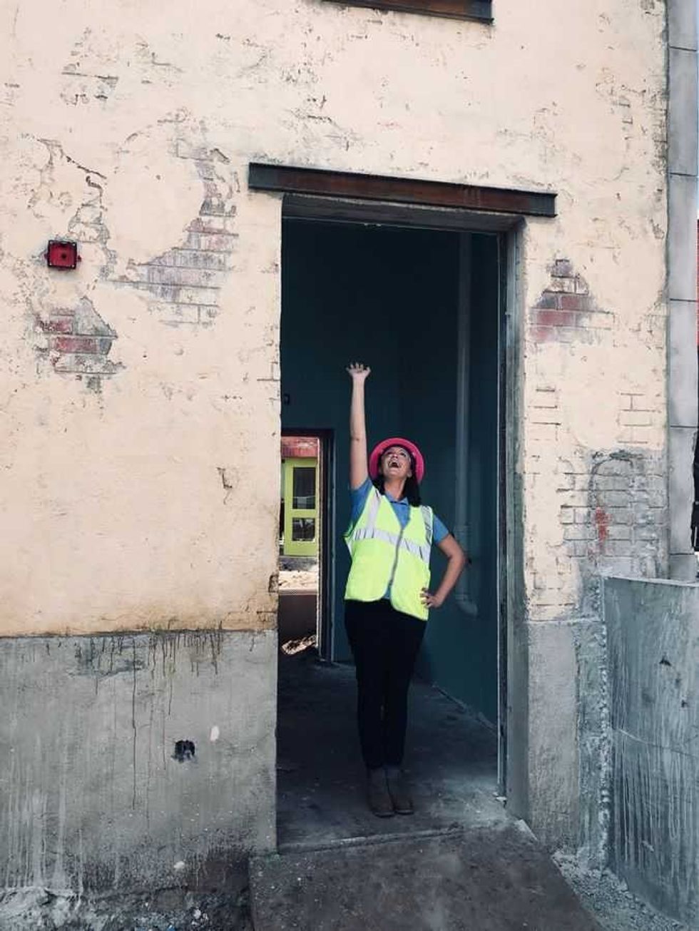 Amanda Trauger standing in a tall doorway at Sesame Street Land at SeaWorld Orlando