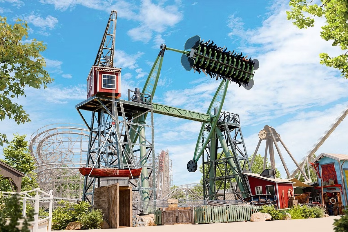 Amusement park ride, Stormvåg at Liseberg, flipping riders upside down on a sunny day.