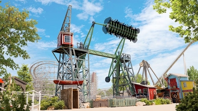 Amusement park ride, Stormvåg at Liseberg, flipping riders upside down on a sunny day.