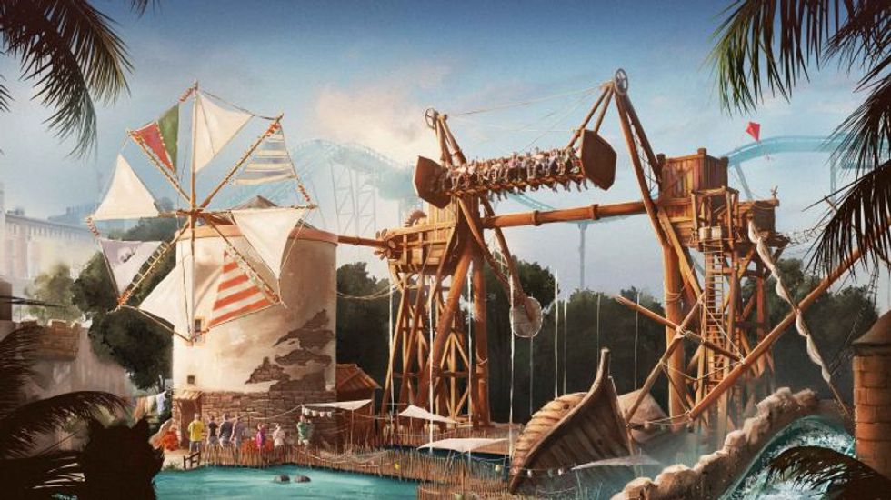 Amusement park ride with sails and a wooden structure over water.