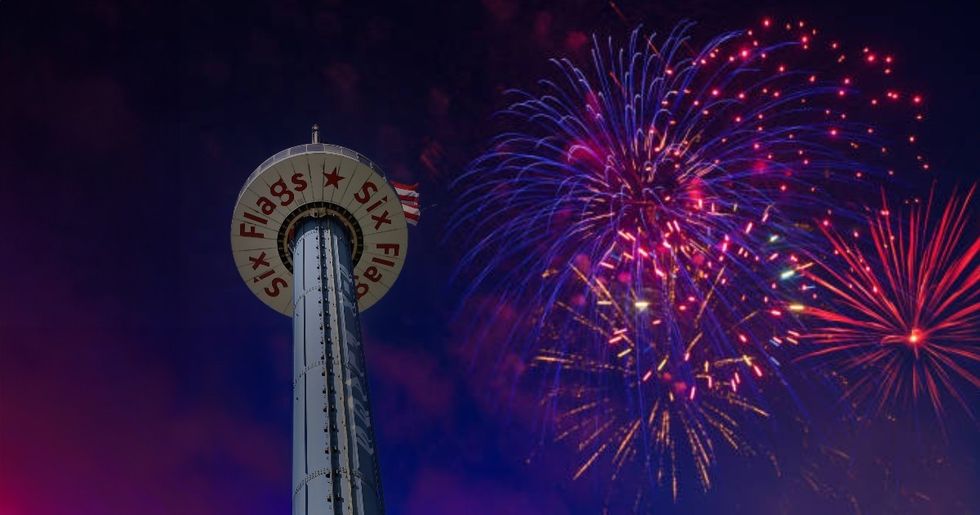 Amusement park tower and fireworks against a night sky at Six Flags Great America