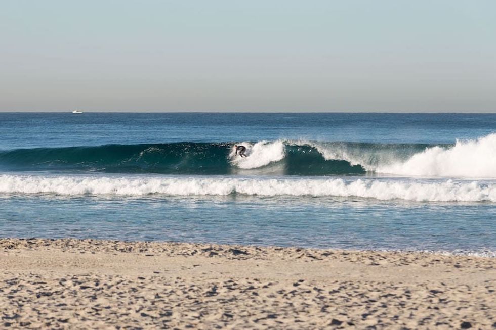 Andrew Thatcher surfing