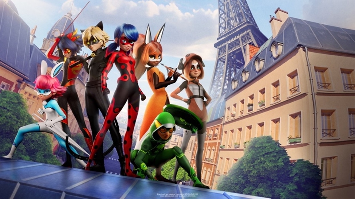 Animated superheroes from Miraculous pose in front of the Eiffel Tower in Paris.