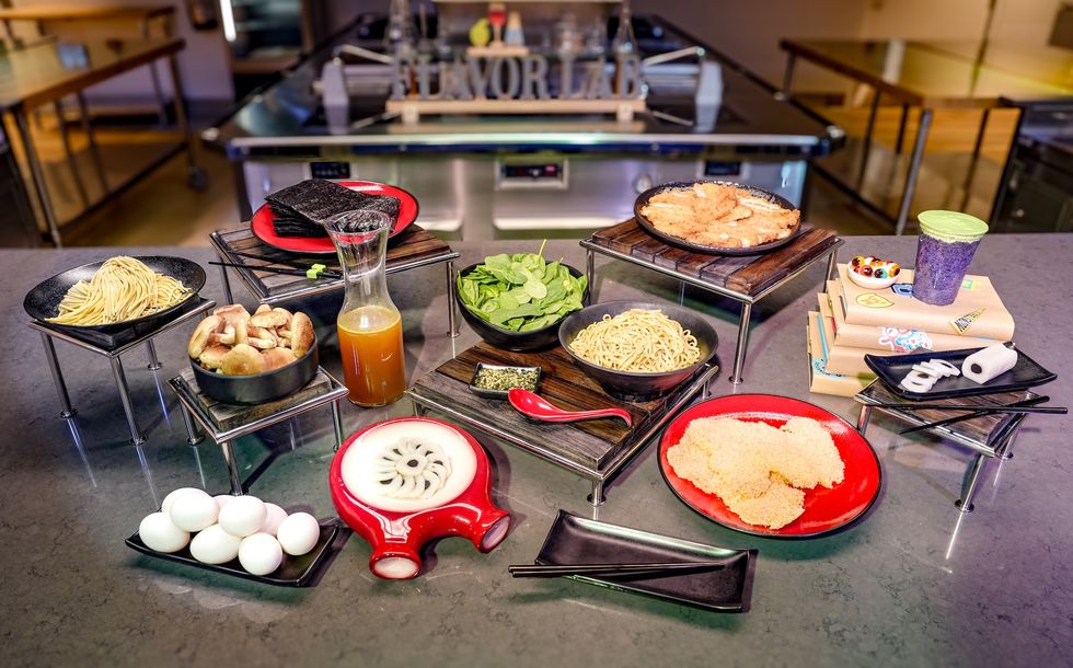 Assorted ramen ingredients and garnishes displayed on a countertop, ready for cooking.