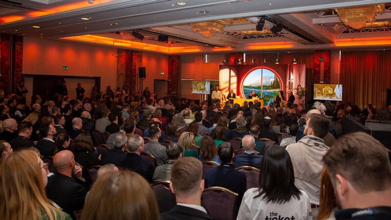 Audience listening to presentation at ILMC