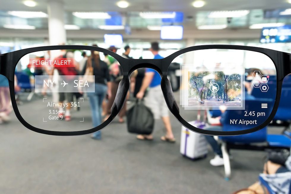 Augmented reality marketing and smart AR glasses technology concept. Customer using AR application to monitoring , check , alert airline flight. Blur Airport background