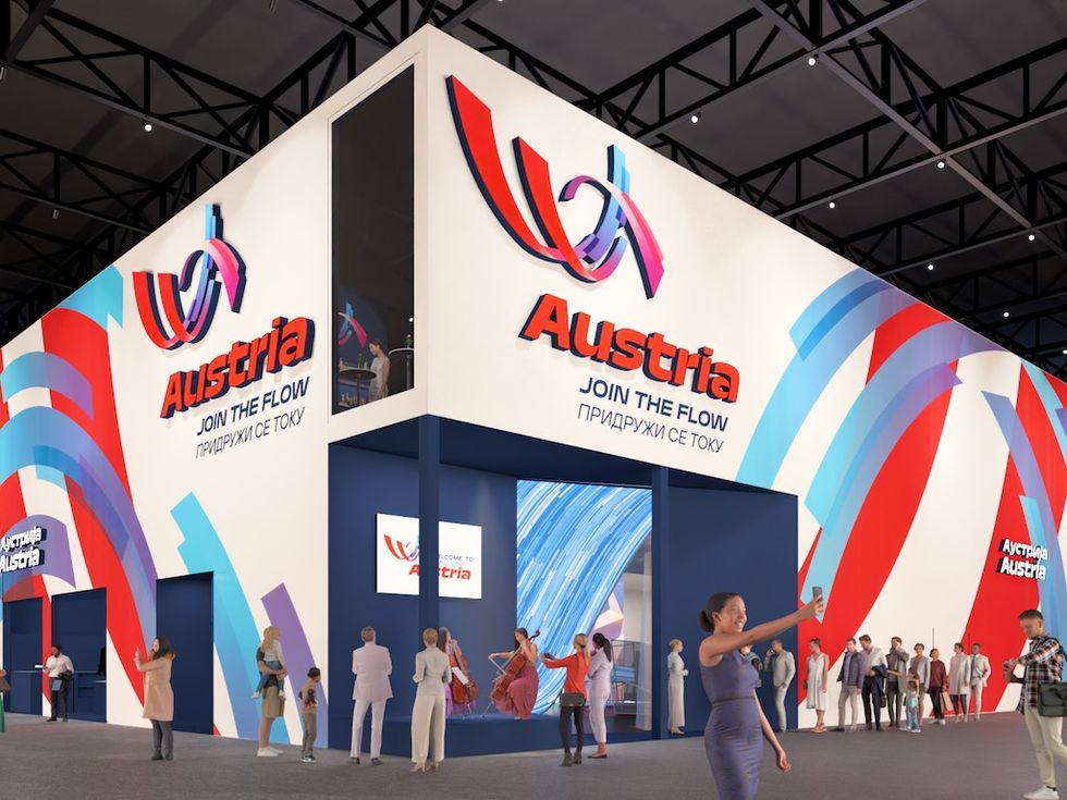 Austria pavilion with colorful design and visitors at an expo.
