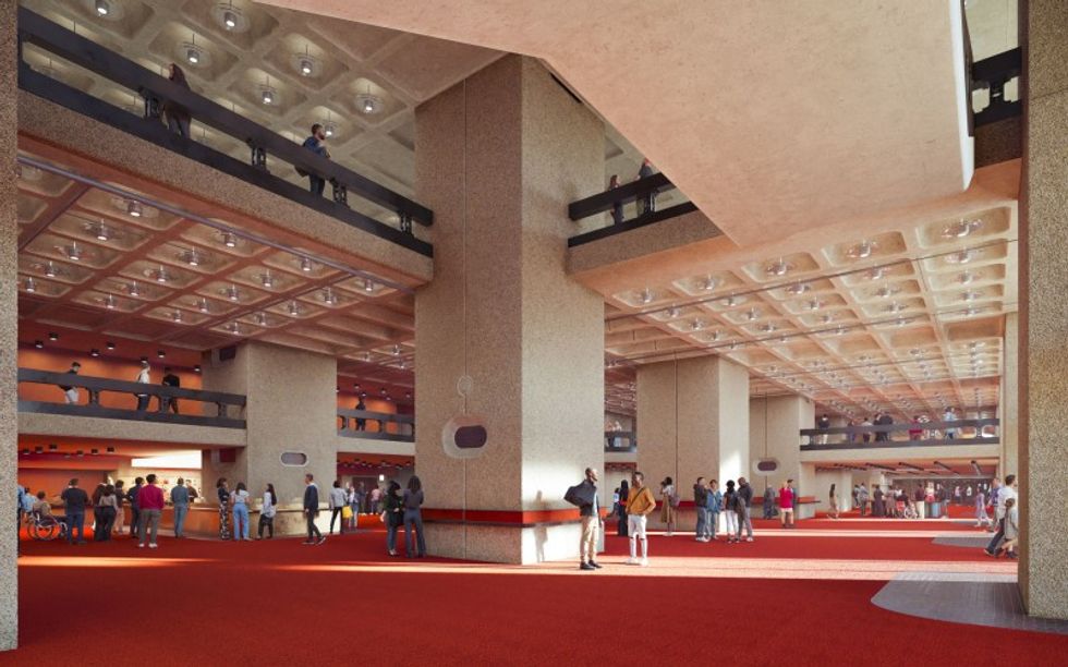 Barbican - spacious atrium with red carpet, concrete pillars, and people on multiple levels.