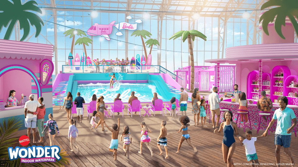 Barbie-themed indoor waterpark with pool, pink d\u00e9cor, and families enjoying various activities.
