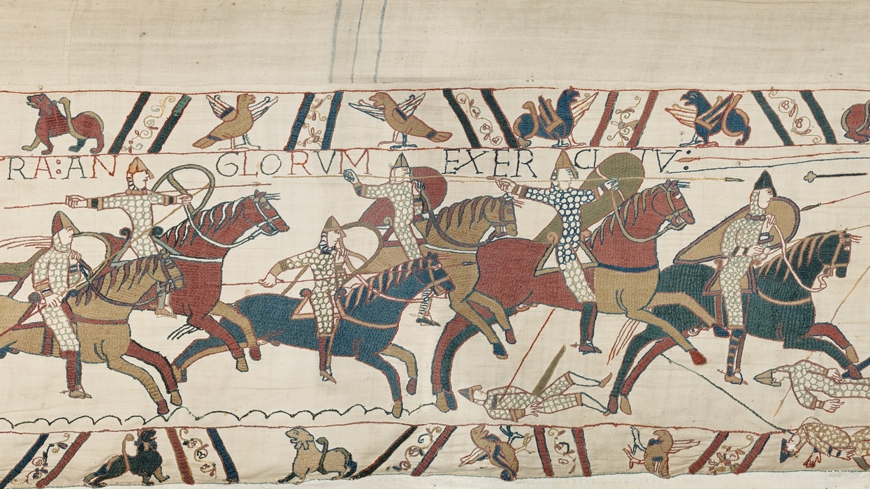 Bayeux Tapestry depicting knights on horseback in a battle scene.