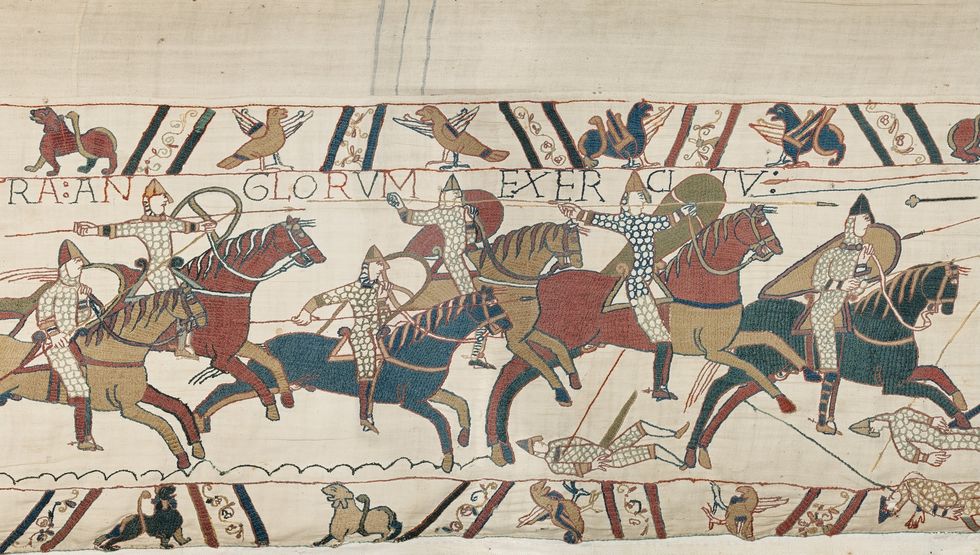 Bayeux Tapestry depicting knights on horseback in a battle scene.