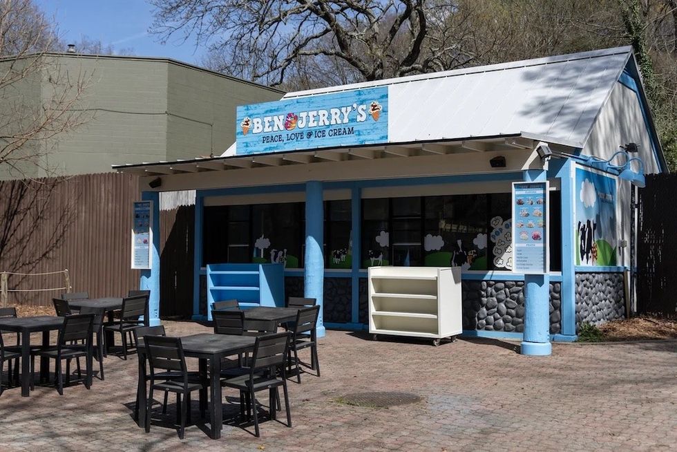 Ben & Jerry's ice cream shop at Zoo Atlanta with outdoor seating and colorful signage.