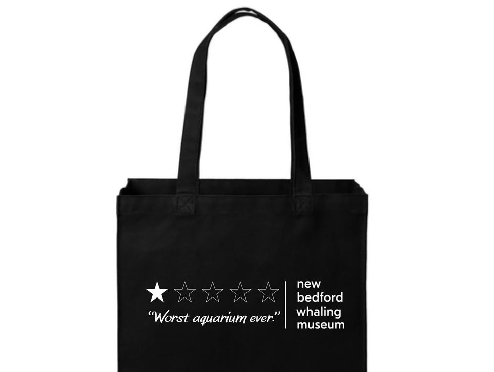 Black tote bag with humorous review: 1-star, "Worst aquarium ever," for New Bedford Whaling Museum.