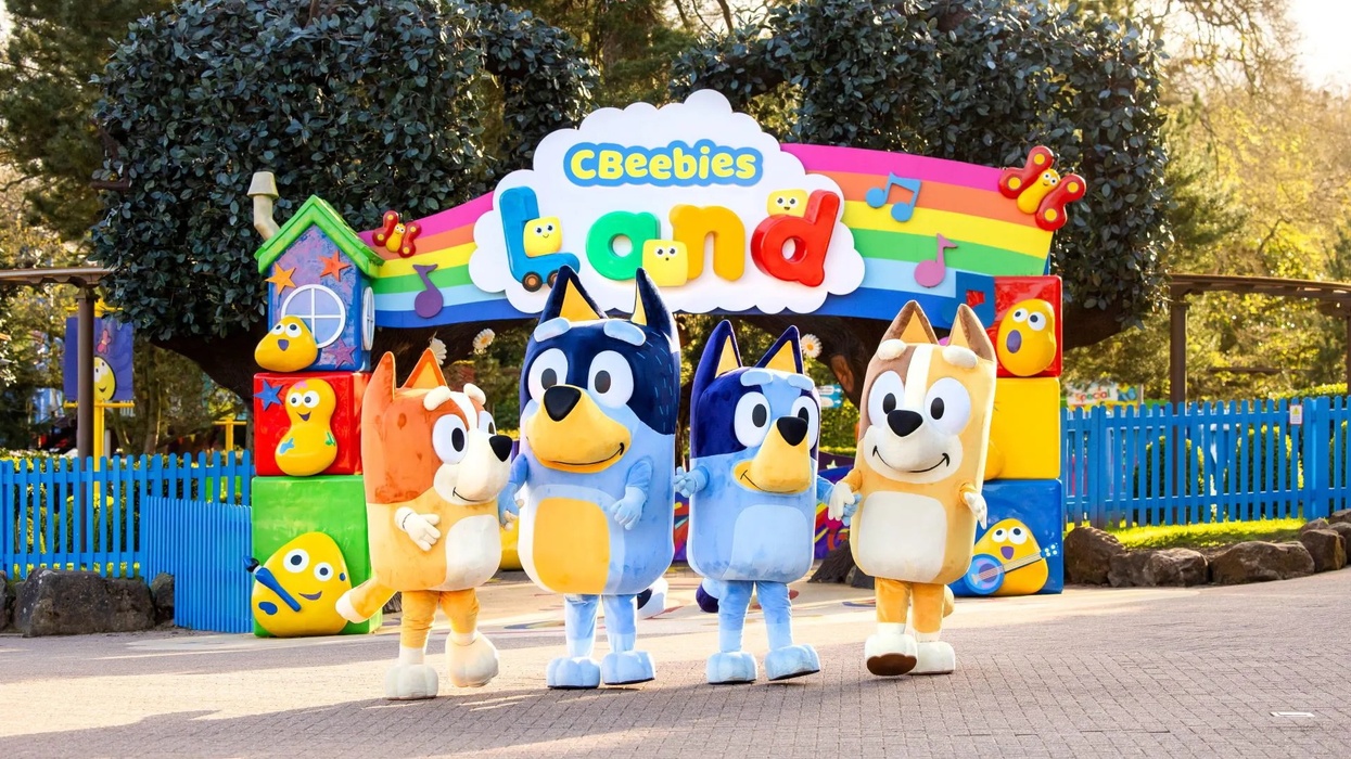 Bluey characters at Alton Towers' CBeebies Land entrance with colorful decorations.
