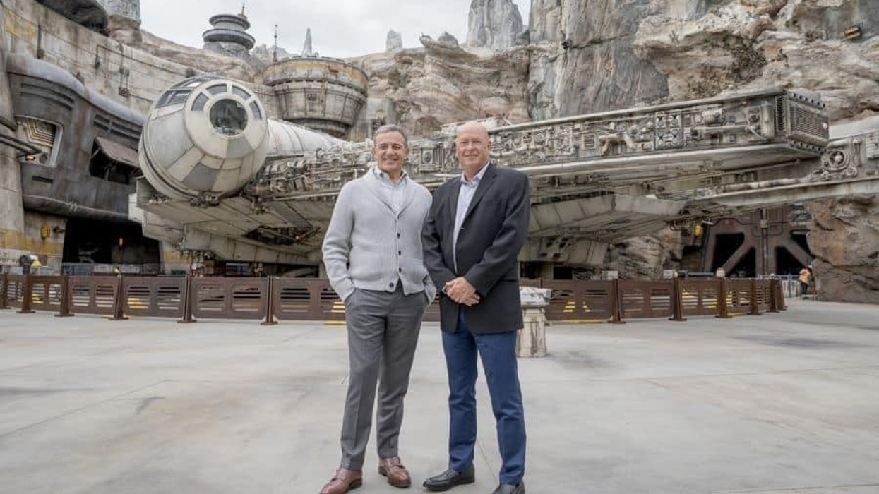 Bob Chapek and Bob Iger stand by the Millenium Falcon at Disney park