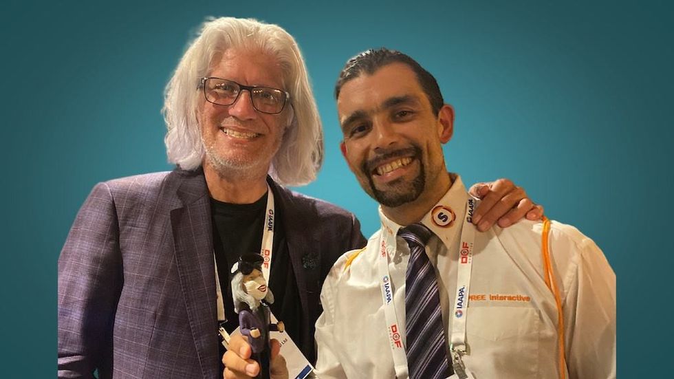Bob Cooney awards Spree's Jonathan Nowak Delgado CEO