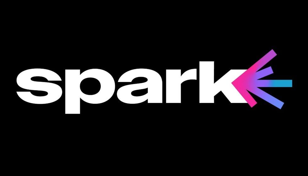 Bold "spark" text with colorful gradient burst from the "k" on a black background.