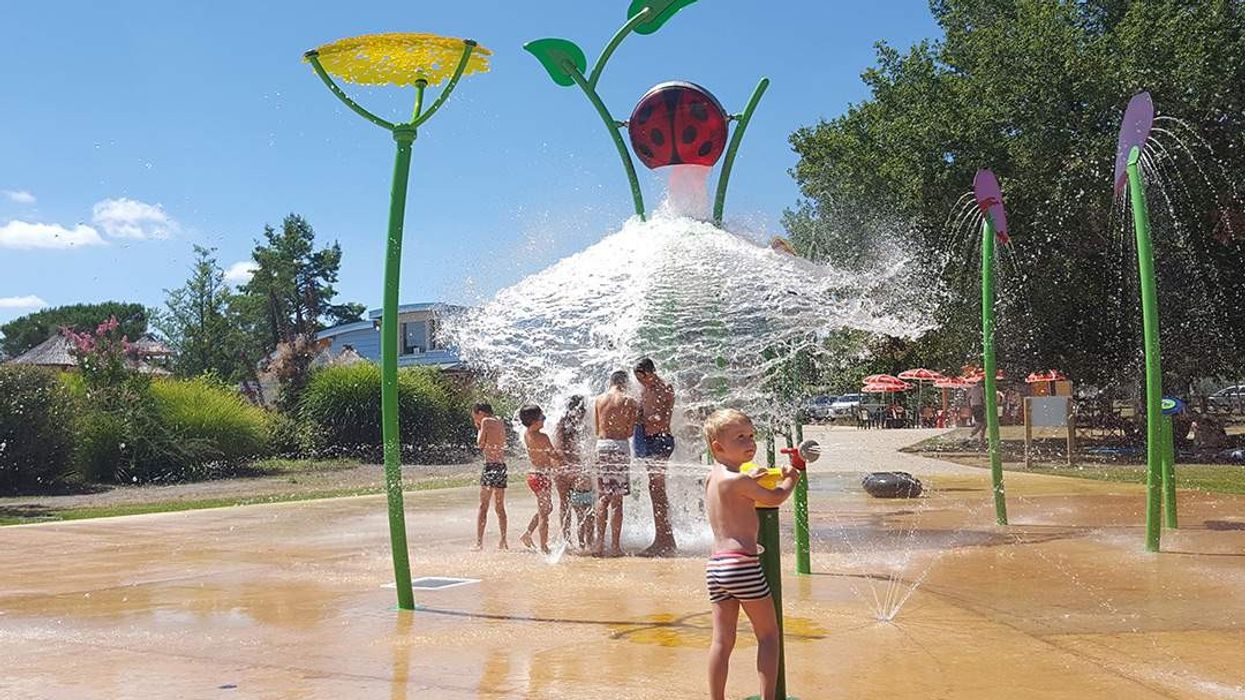boy plays with waterplay's ladybird soaker installed by KASO
