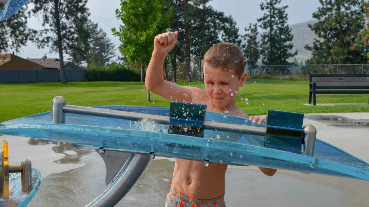 boy plays with waterways elements by waterplay solutions