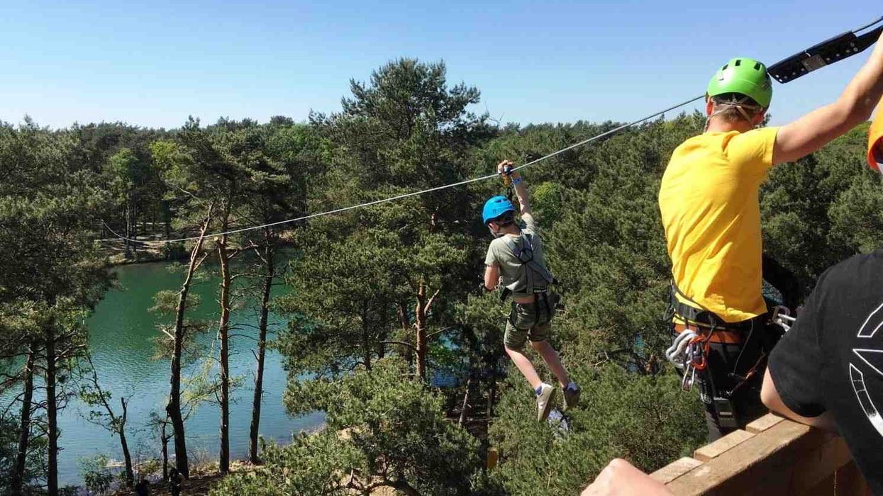 boy rides zilvermeer zipline with kanopeo saferoller belay system