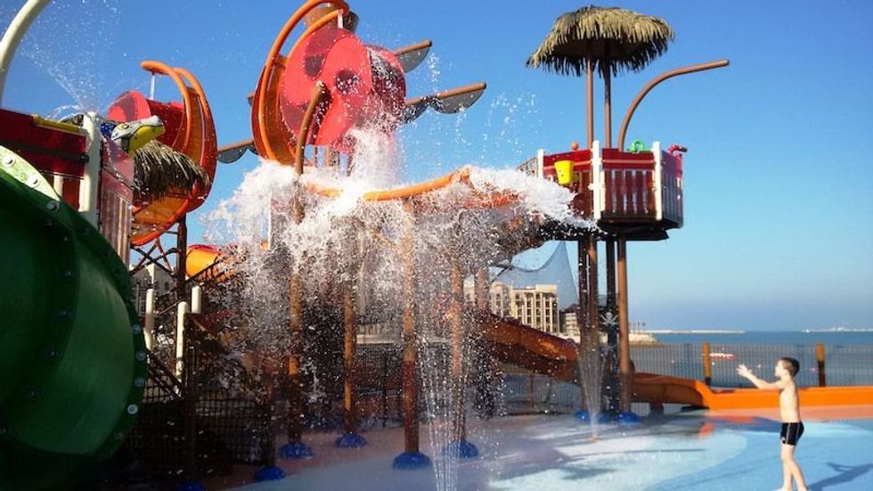 boy with aquatic play equipment from vortex