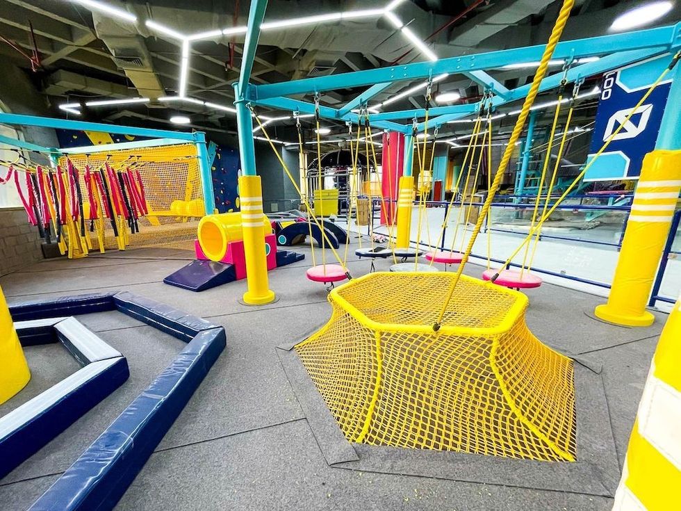 Brightly coloured play equipment from Walltopia at Nomad Entertainment Center