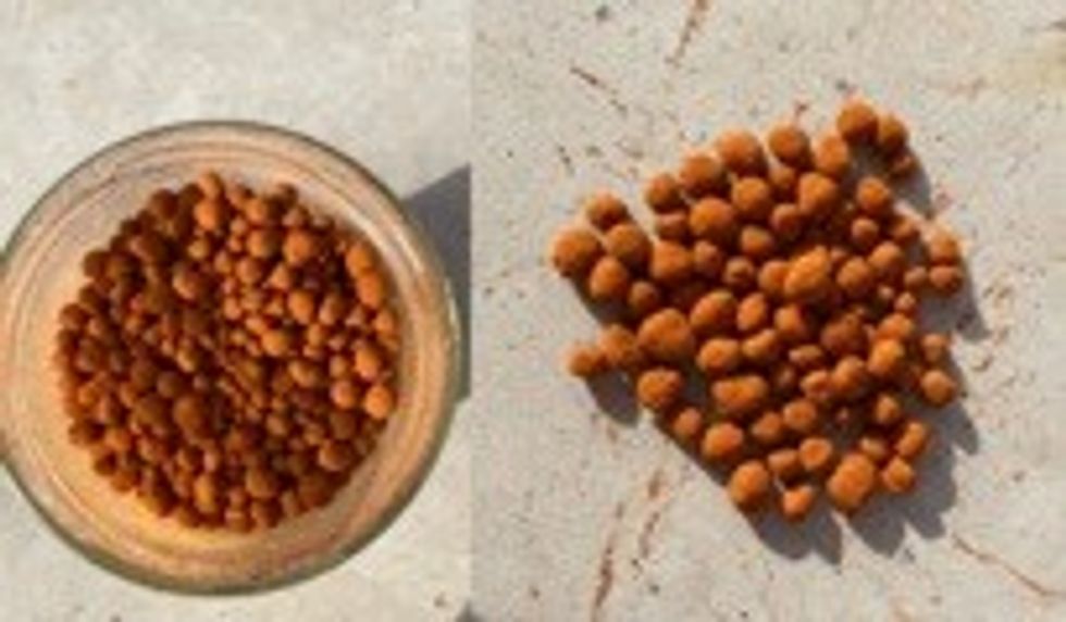 Brown granules in a jar and on a surface, viewed from above.