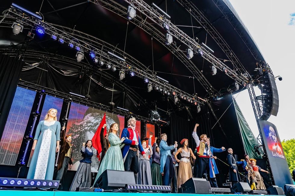 Cast of Les Mis performing at West End Live