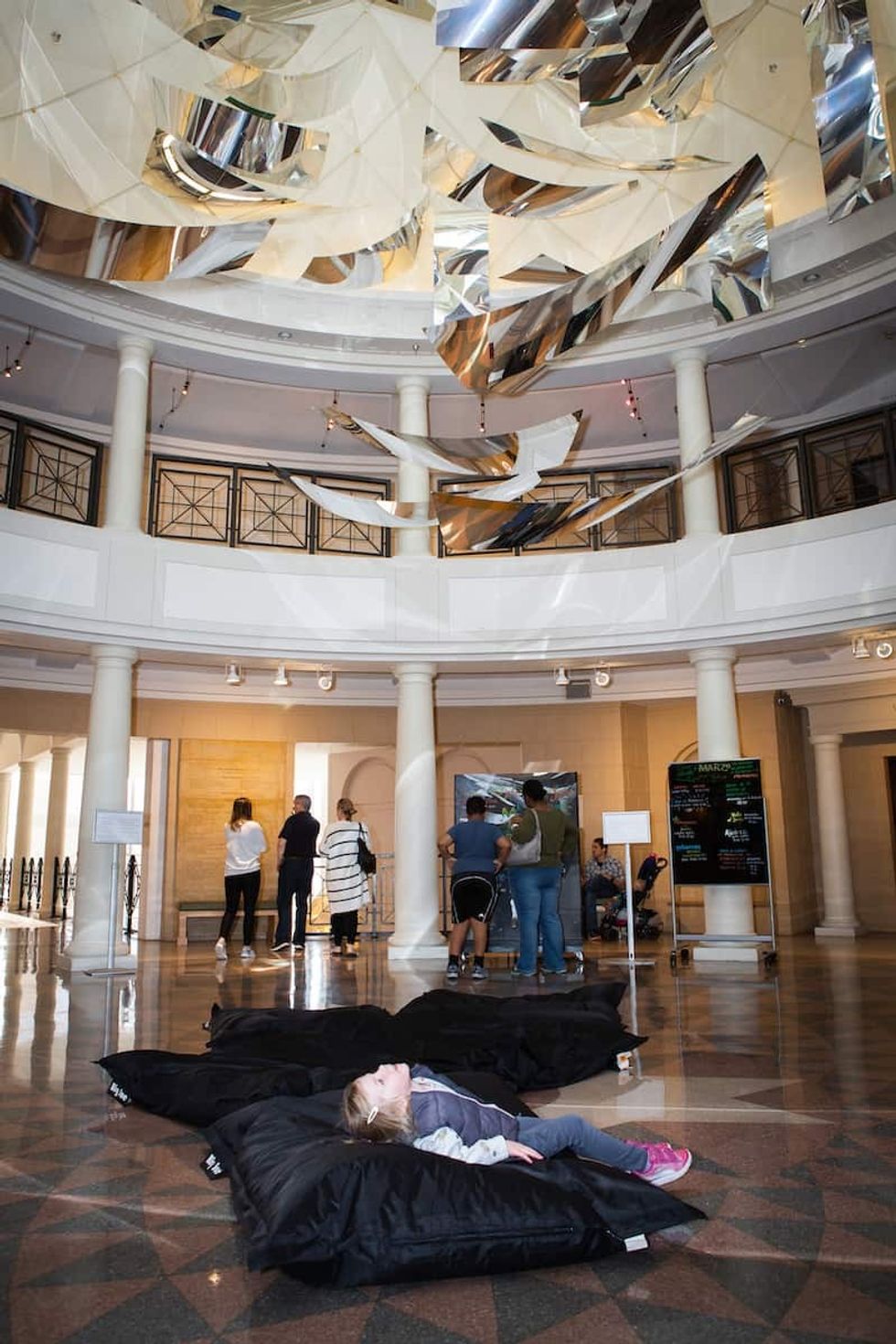 child enjoying mirror art