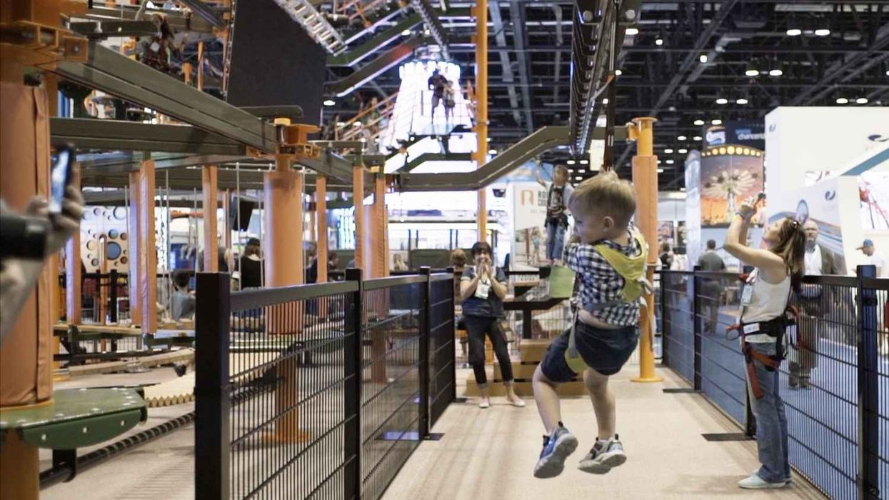 child tries Sky Tykes ropes course with sky rail zip line from innovative leisure