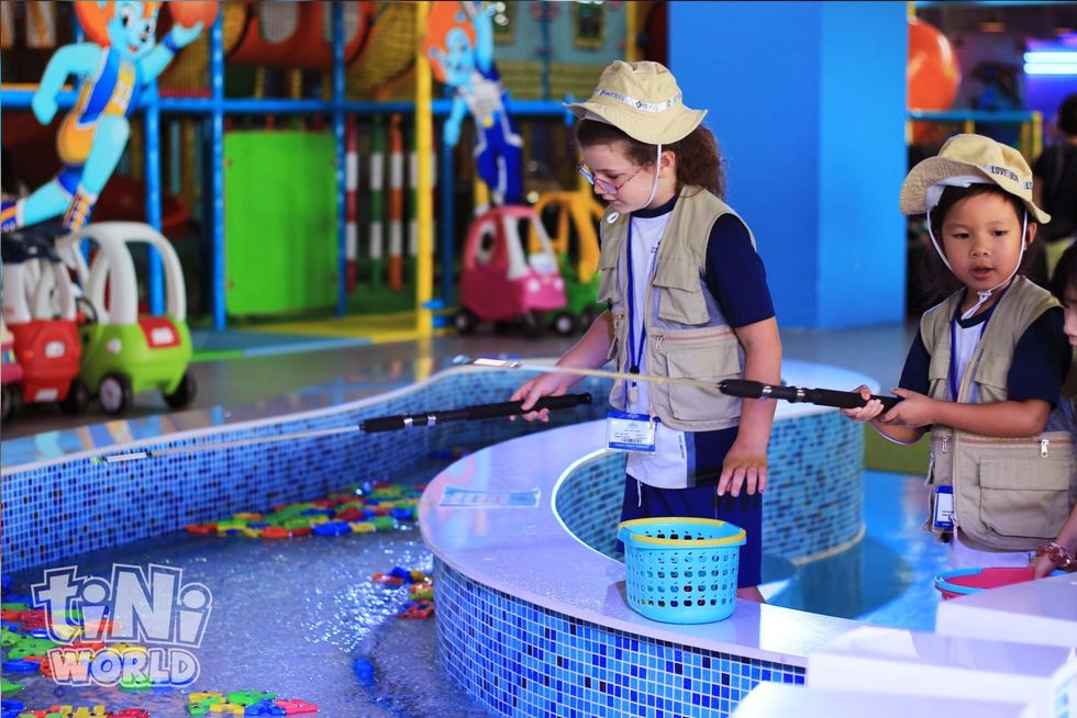 children fishing tiNiWorld Vietnam