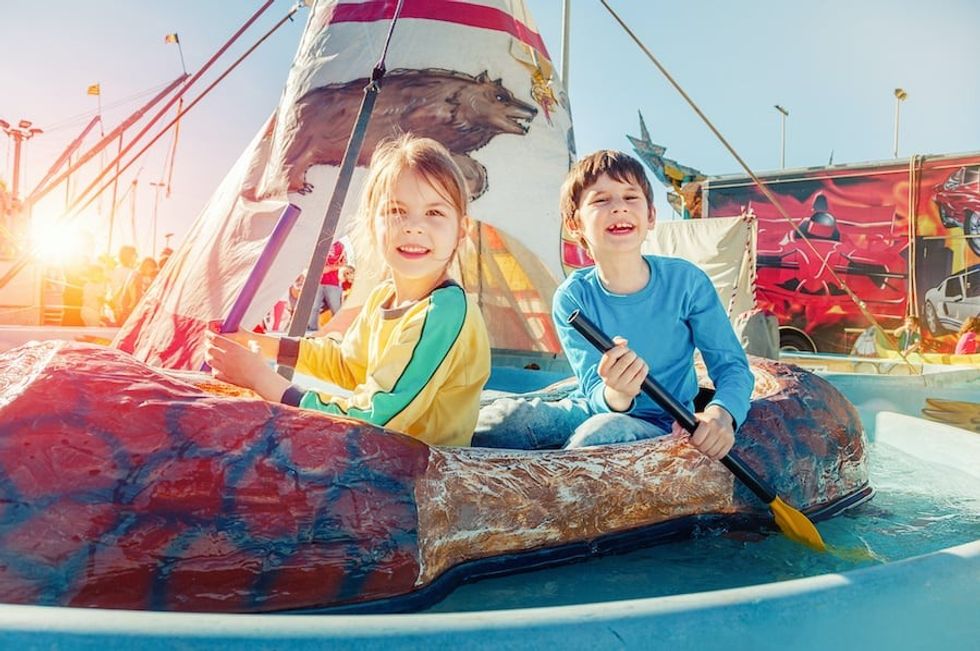 children-on-canoe-ride-theme-park