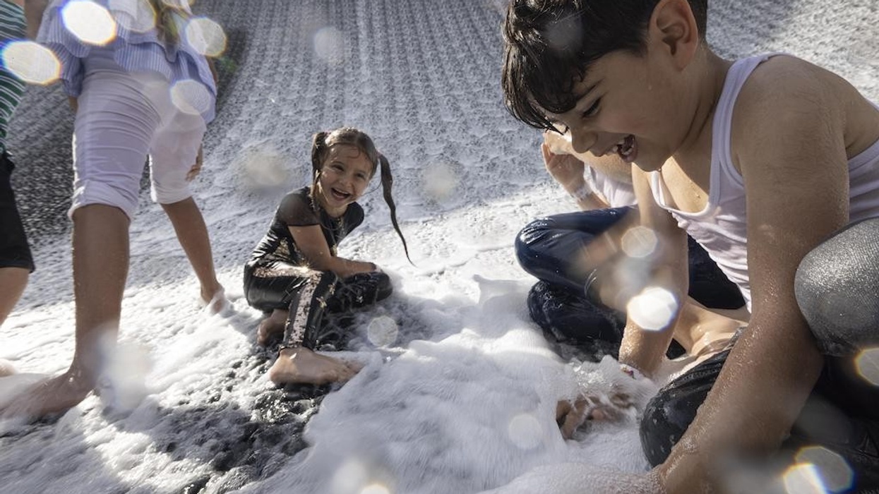 Children play at Surreal, The Water Feature